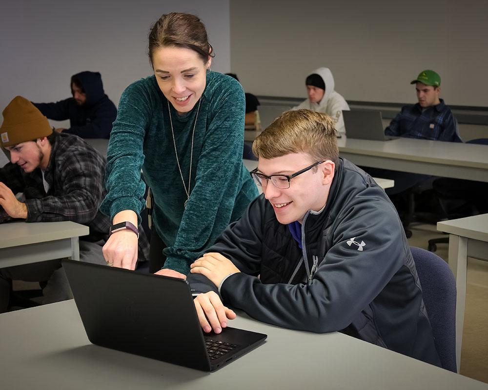 A student receiving help from an advisor 