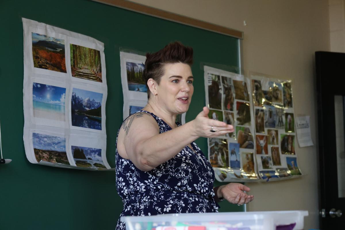 A professor presenting in front of a classroom